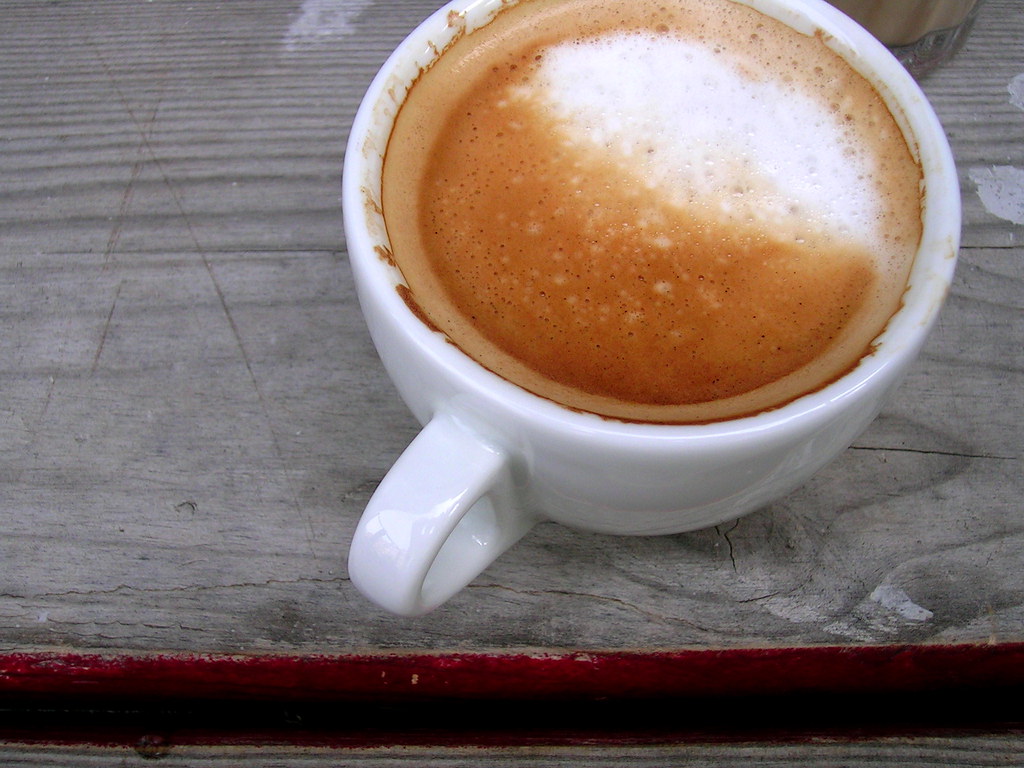 coffee in a porcelain mug on a wooden table