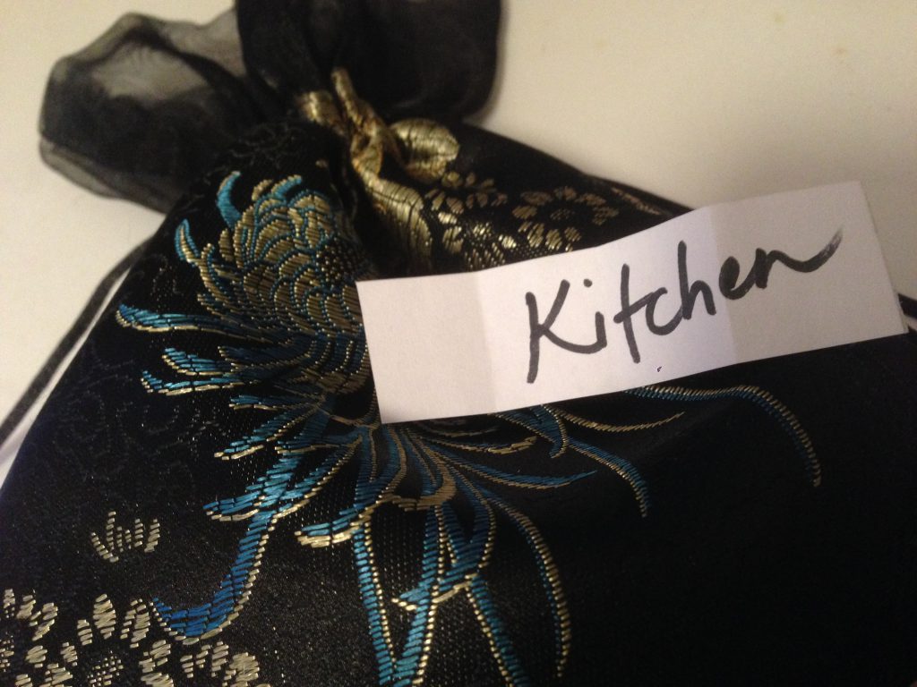 "Kitchen" written on a slip of paper that was pulled from a bag