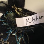 "Kitchen" written on a slip of paper that was pulled from a bag