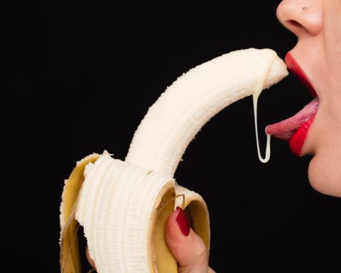 banana licked by woman