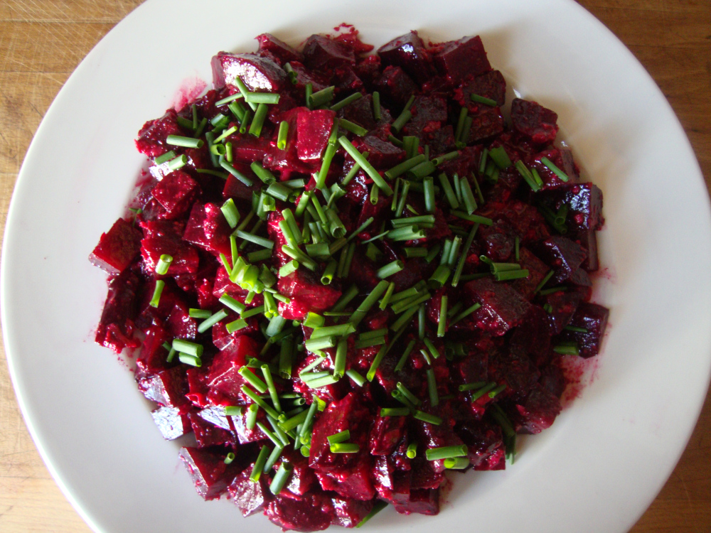 vegan spicy beet salad with spring onion slices