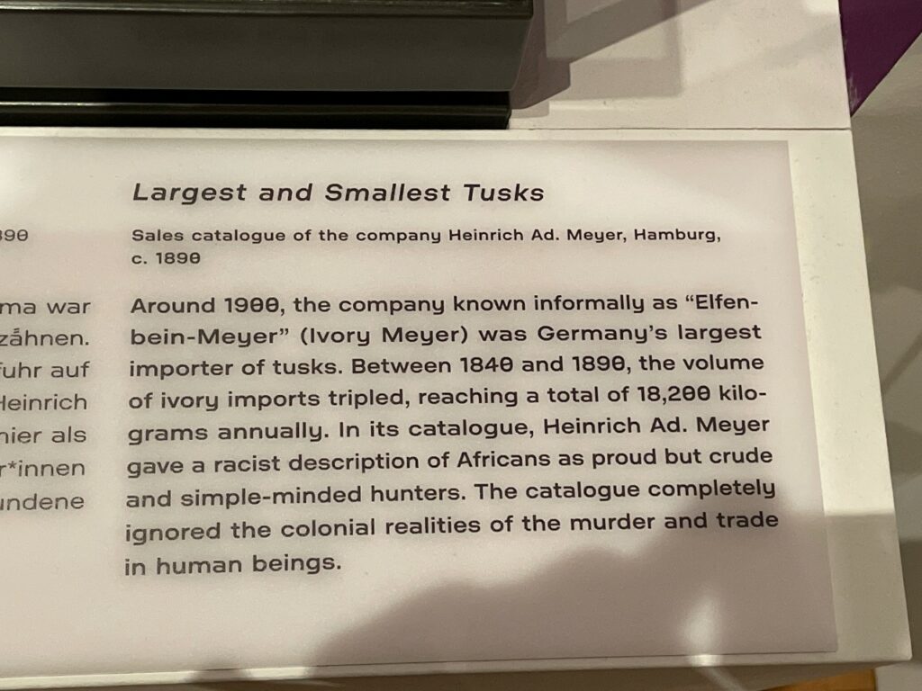 Exhibition text detailing racist marketing in ivory trade, Terrible Beauty, Humboldt Forum