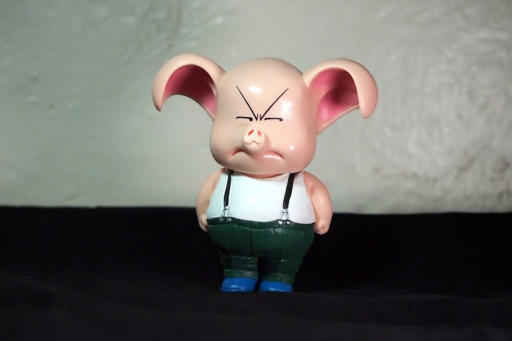 toy pig with a scowl on its face